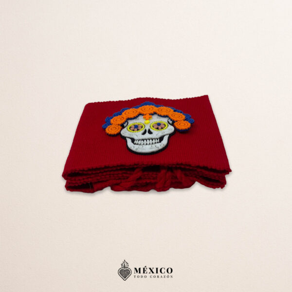 Red artisan Mexican waist belt featuring a Catrina felt appliqué