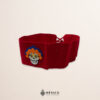 Red artisan Mexican waist belt featuring a Catrina felt appliqué