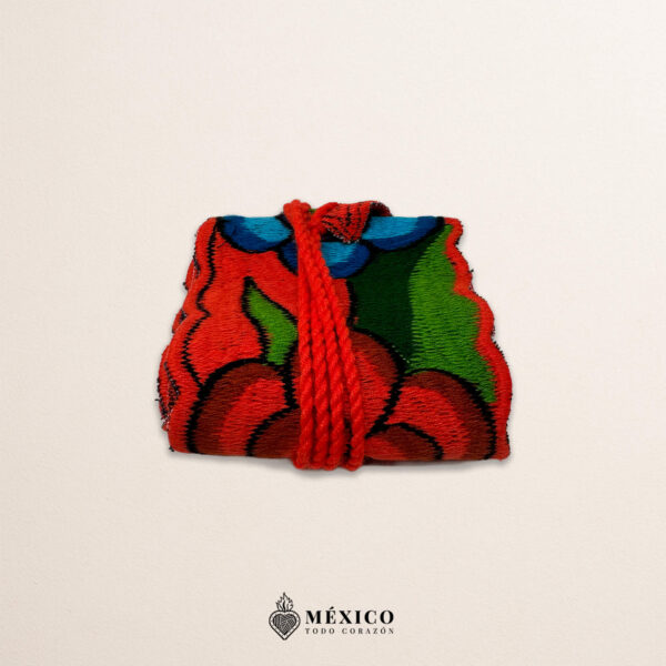 Handwoven Mexican waist belt (faja) featuring colorful flower embellishments and orange ties
