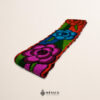 Handwoven Mexican waist belt (faja) featuring colorful flower embellishments and orange ties