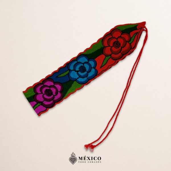 Handwoven Mexican waist belt (faja) featuring colorful flower embellishments and orange ties