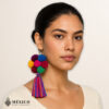 Handmade Mexican flowers earrings featuring multicolor yarn pom-pom embellishments