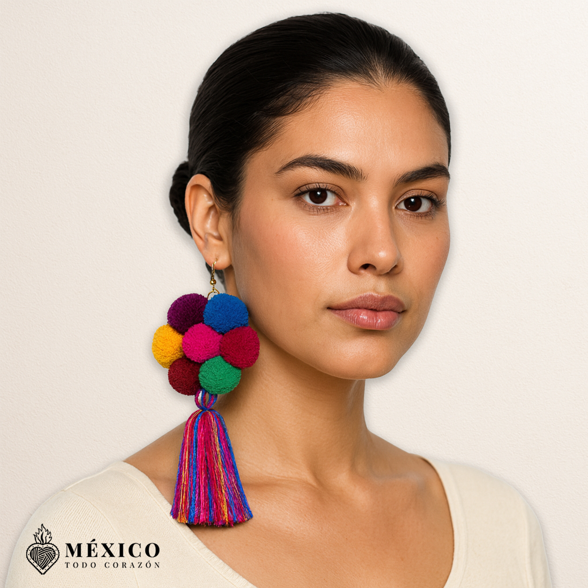 Handmade Mexican flowers earrings featuring multicolor yarn pom-pom embellishments
