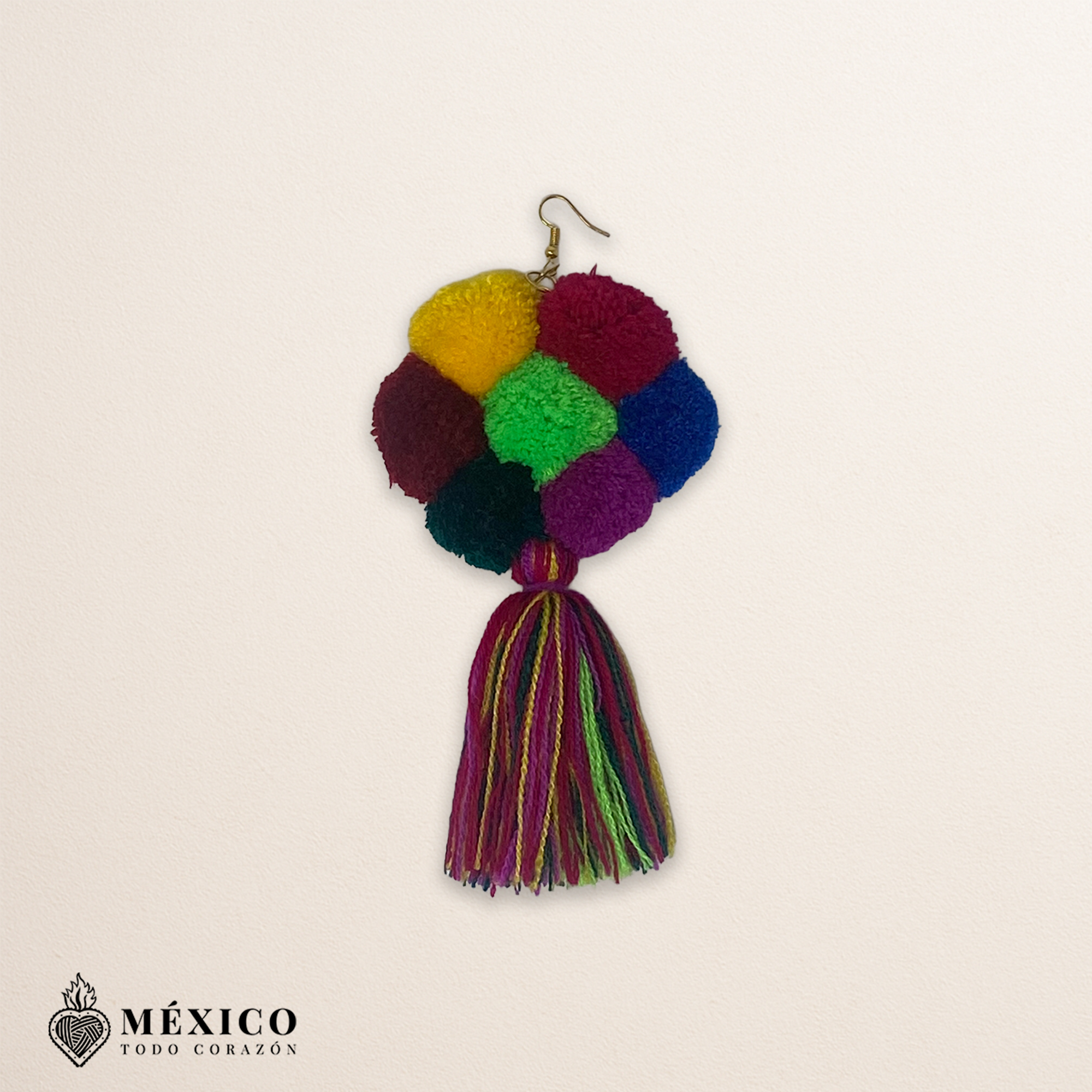 Handmade Mexican flowers earrings featuring multicolor yarn pom-pom embellishments