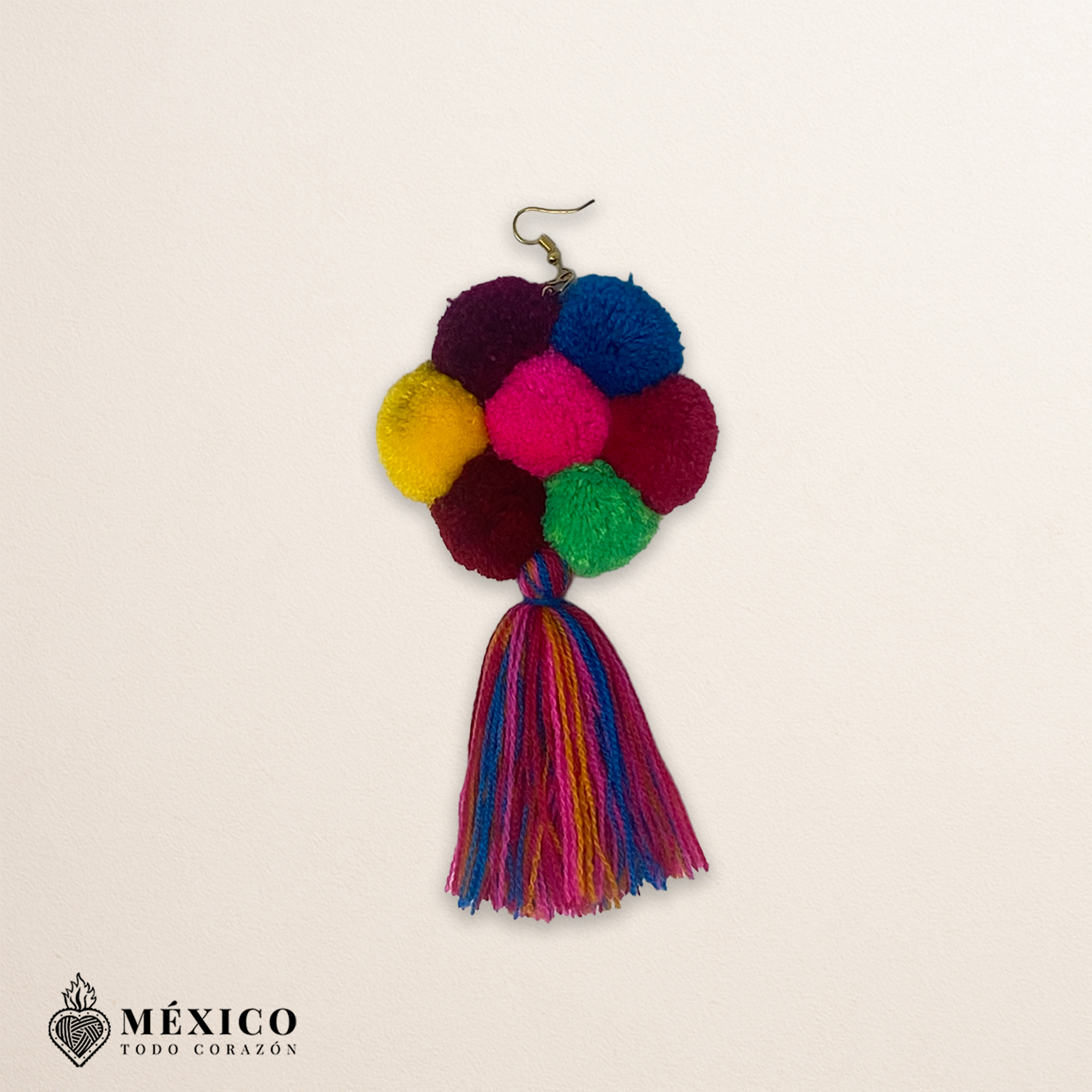 Handmade Mexican flowers earrings featuring multicolor yarn pom-pom embellishments