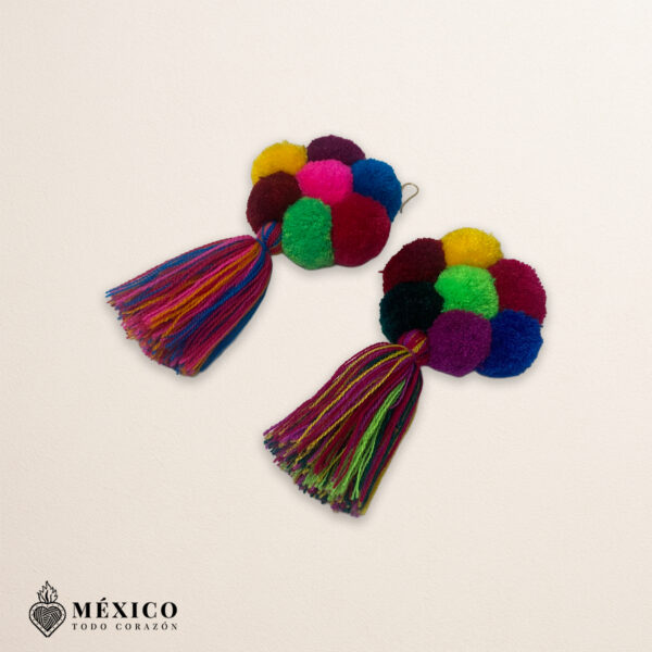 Handmade Mexican flowers earrings featuring multicolor yarn pom-pom embellishments