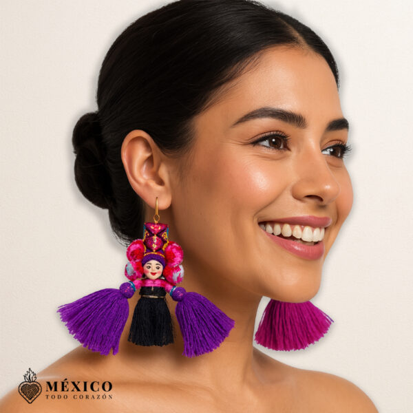Handmade pink and purple Mexican dolls earrings featuring multicolor yarn pom-pom embellishments