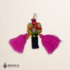 Handmade pink and purple Mexican dolls earrings featuring multicolor yarn pom-pom embellishments