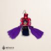 Handmade pink and purple Mexican dolls earrings featuring multicolor yarn pom-pom embellishments