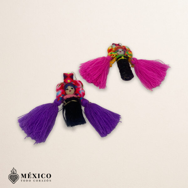 Handmade pink and purple Mexican dolls earrings featuring multicolor yarn pom-pom embellishments