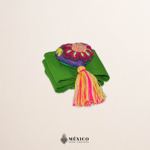 Green artisan Mexican waist belt featuring a floral heart embellishment in multicolor felt