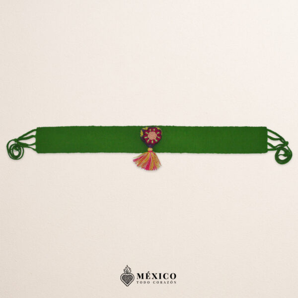 Green artisan Mexican waist belt featuring a floral heart embellishment in multicolor felt