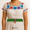 Green artisan Mexican waist belt featuring a floral heart embellishment in multicolor felt