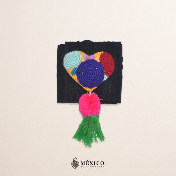 Black artisan waist belt featuring floral embroidery and a heart-shaped felt embellishment