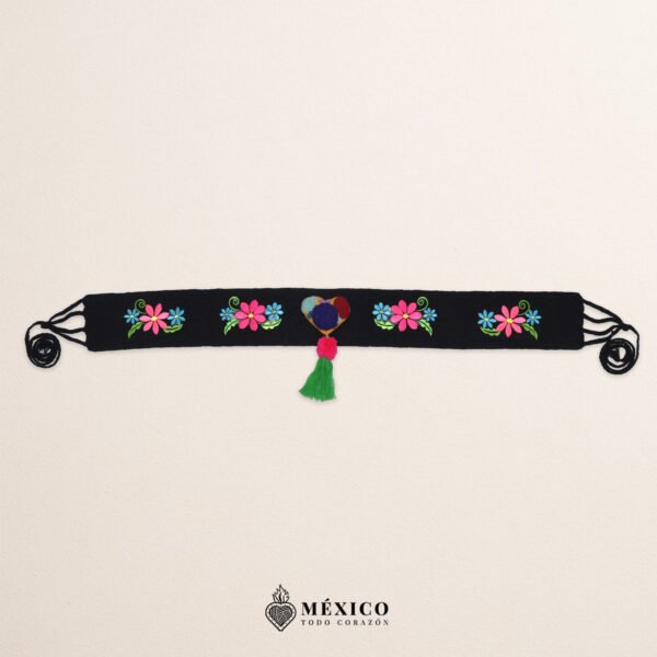 Black artisan waist belt featuring floral embroidery and a heart-shaped felt embellishment
