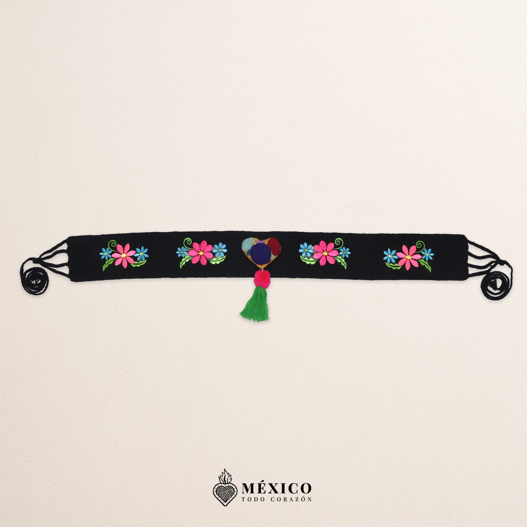 Black artisan waist belt featuring floral embroidery and a heart-shaped felt embellishment