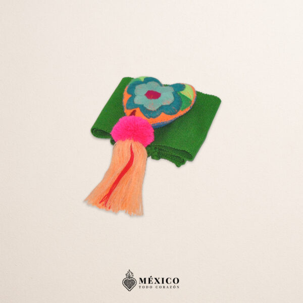 Green Mexican waist belt featuring floral embroidery and a heart embellishment in felt
