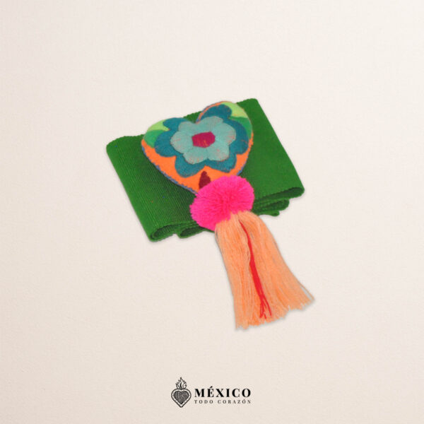 Green Mexican waist belt featuring floral embroidery and a heart embellishment in felt