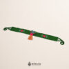 Green Mexican waist belt featuring floral embroidery and a heart embellishment in felt