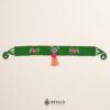 Green Mexican waist belt featuring floral embroidery and a heart embellishment in felt