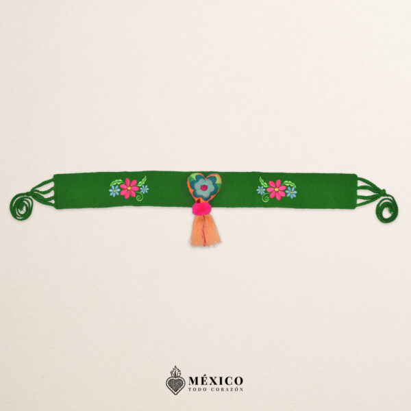 Green Mexican waist belt featuring floral embroidery and a heart embellishment in felt