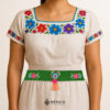 Green Mexican waist belt featuring floral embroidery and a heart embellishment in felt
