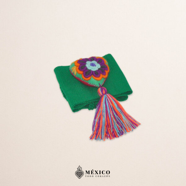 Green artisan Mexican waist belt featuring a floral heart embellishment in felt appliqué