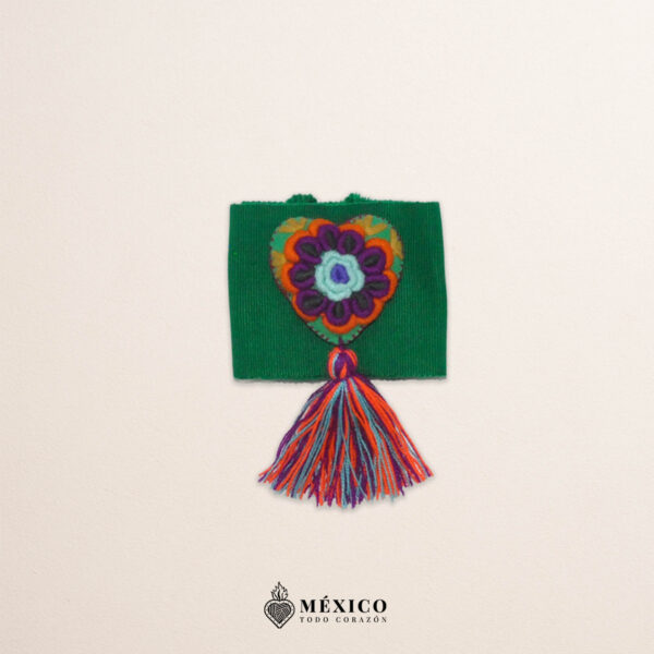 Green artisan Mexican waist belt featuring a floral heart embellishment in felt appliqué