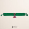 Green artisan Mexican waist belt featuring a floral heart embellishment in felt appliqué