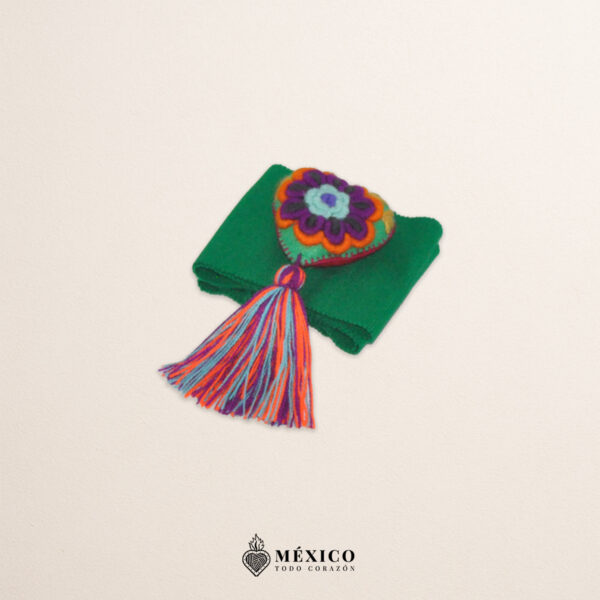 Green artisan Mexican waist belt featuring a floral heart embellishment in felt appliqué