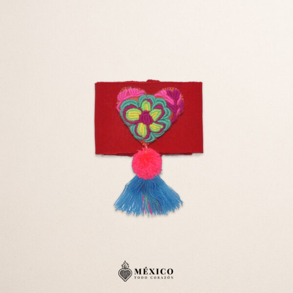 Red artisan waist belt featuring floral embroidery and a heart embellishment in felt appliqué