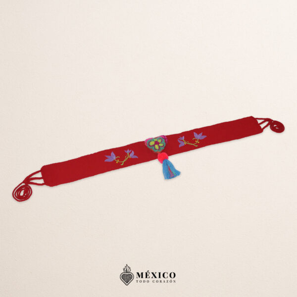 Red artisan waist belt featuring floral embroidery and a heart embellishment in felt appliqué