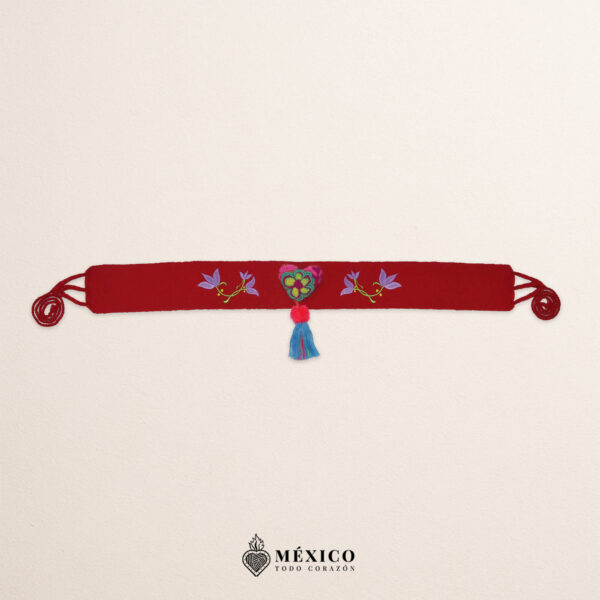 Red artisan waist belt featuring floral embroidery and a heart embellishment in felt appliqué
