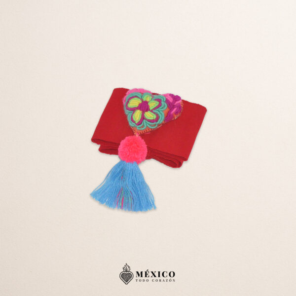 Red artisan waist belt featuring floral embroidery and a heart embellishment in felt appliqué