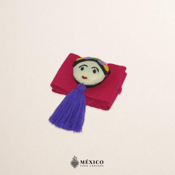 Fuchsia artisan waist belt featuring floral embroidery and a Mexican doll embellishment