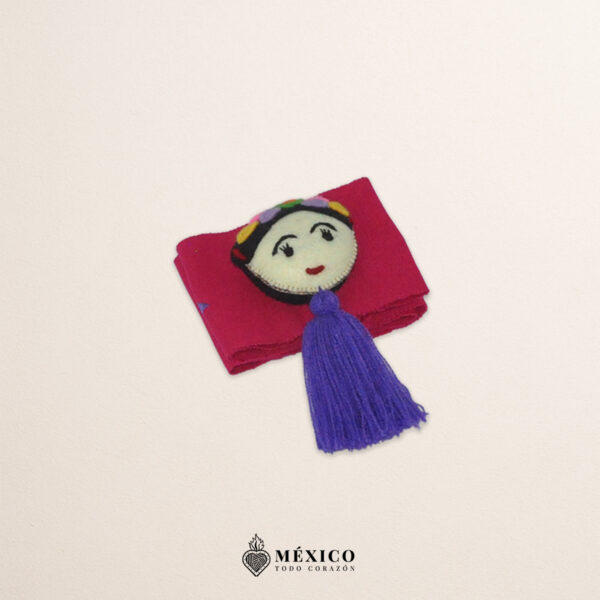 Fuchsia artisan waist belt featuring floral embroidery and a Mexican doll embellishment