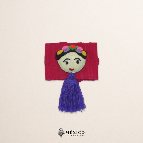 Fuchsia artisan waist belt featuring floral embroidery and a Mexican doll embellishment