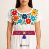 Fuchsia artisan waist belt featuring floral embroidery and a Mexican doll embellishment