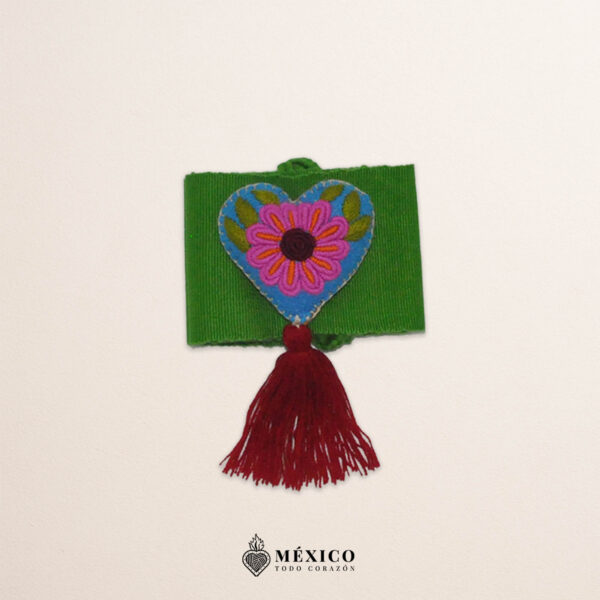 Green artisan Mexican waist belt featuring a floral heart embellishment in felt appliqué