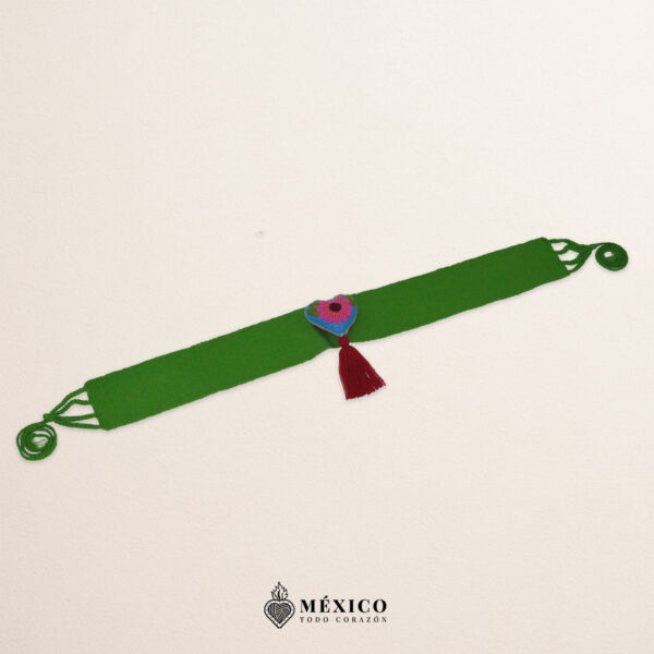 Green artisan Mexican waist belt featuring a floral heart embellishment in felt appliqué