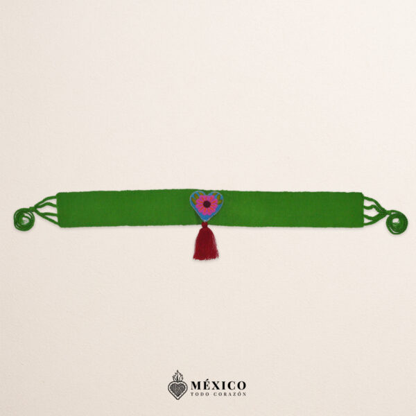 Green artisan Mexican waist belt featuring a floral heart embellishment in felt appliqué