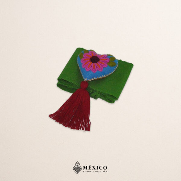 Green artisan Mexican waist belt featuring a floral heart embellishment in felt appliqué