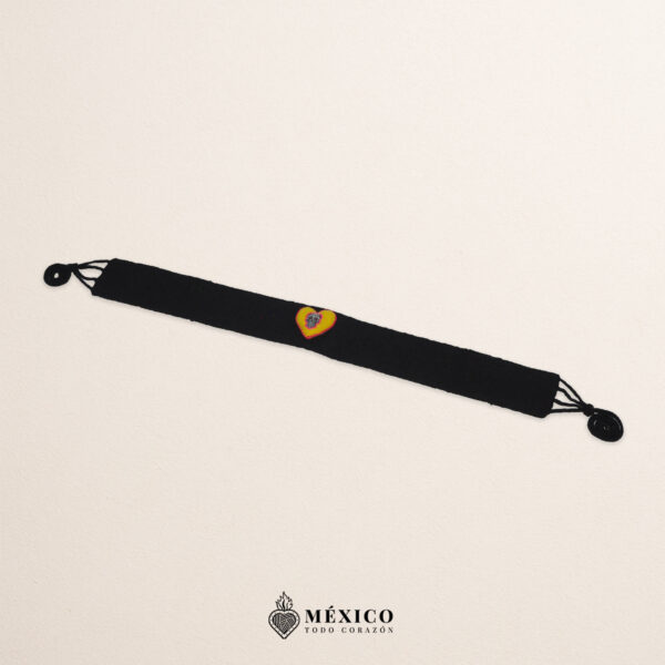 Black artisan waist belt featuring a heart with Catrina embellishment in felt appliqué