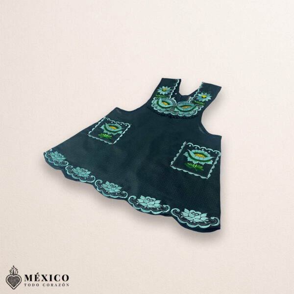 Mint green Mexican embroidered cotton apron featuring floral motifs, ideal cooking gift