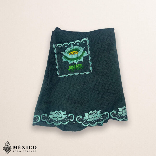 Mint green Mexican embroidered cotton apron featuring floral motifs, ideal cooking gift