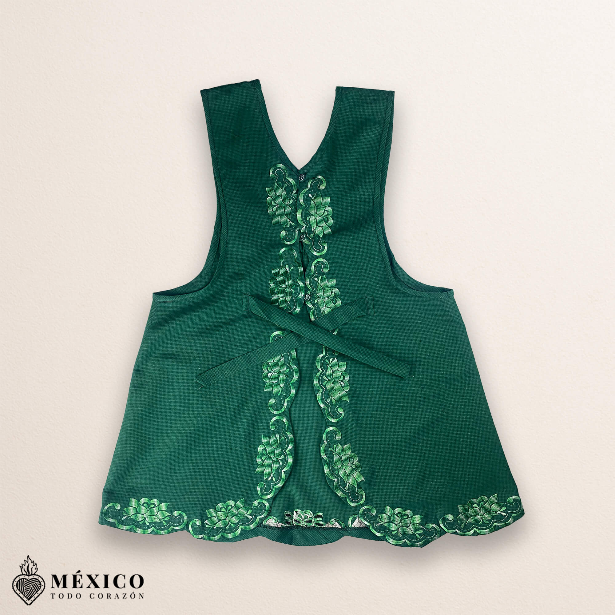 Green Mexican embroidered cotton apron featuring floral motifs, perfect kitchen and cooking gift
