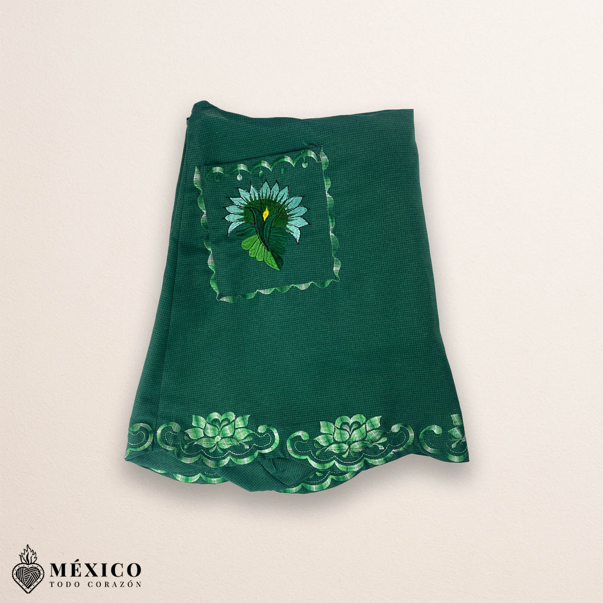 Green Mexican embroidered cotton apron featuring floral motifs, perfect kitchen and cooking gift