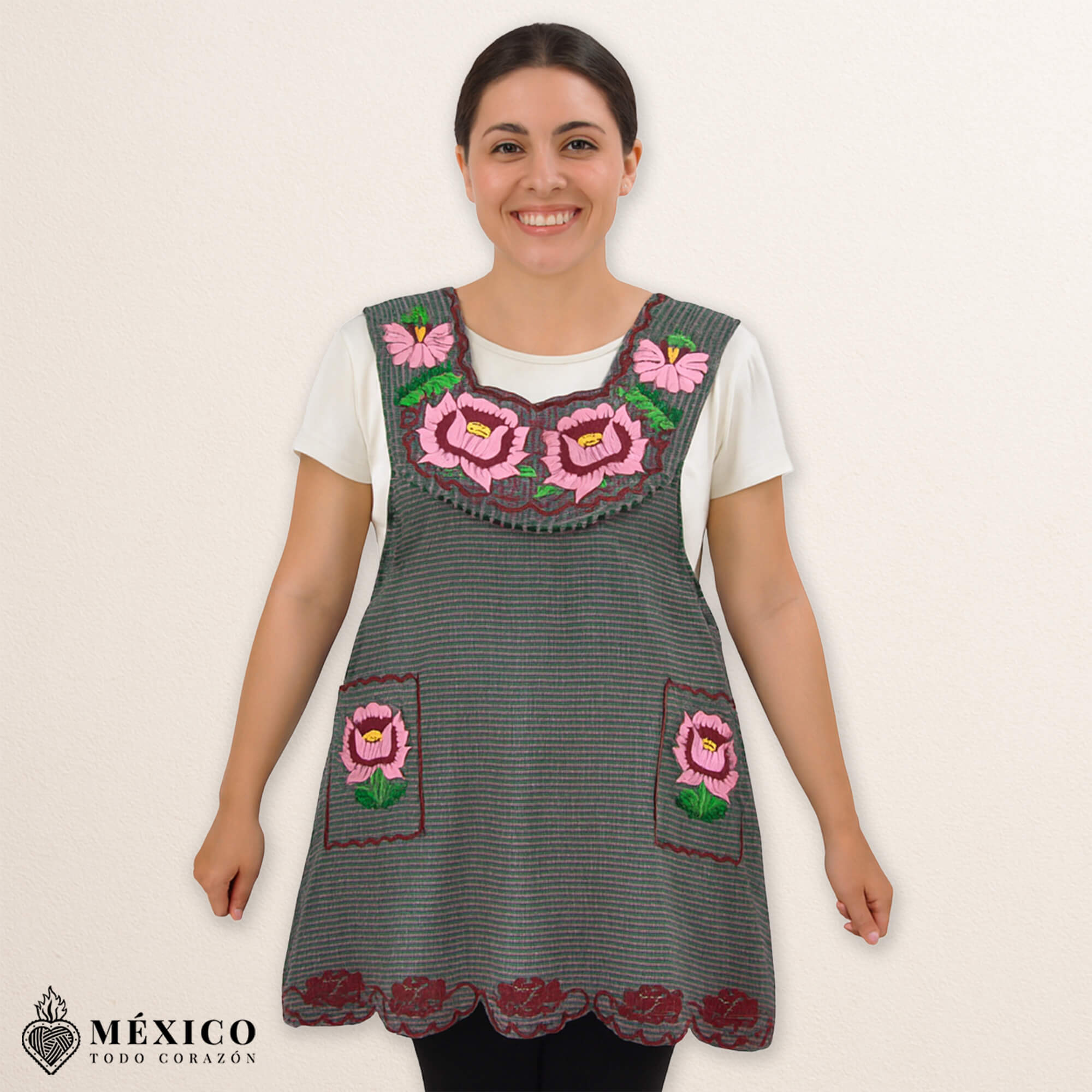 Gray Mexican embroidered cotton apron featuring pink floral design, perfect kitchen and cooking gift