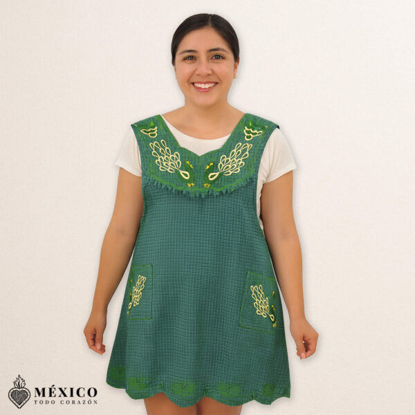 Green Mexican embroidered cotton apron featuring an olive peacock design, perfect kitchen and cooking gift