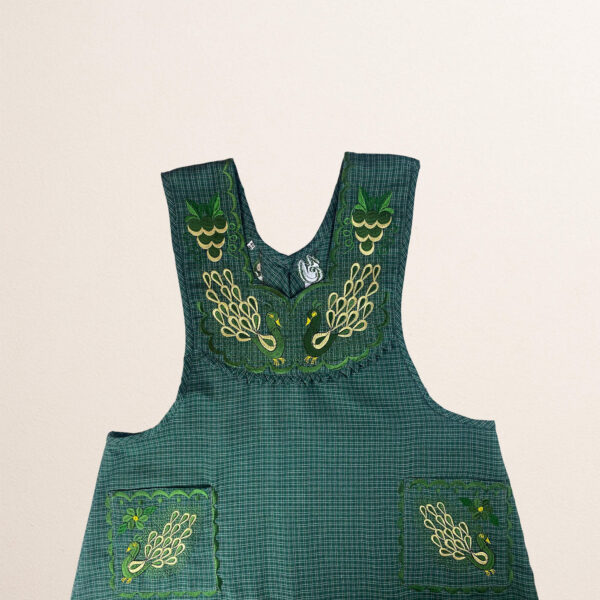 Green Mexican embroidered cotton apron featuring an olive peacock design, perfect kitchen and cooking gift
